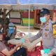 Jaga Jakarta di Pulau Untung Jawa, Bhabinkamtibmas Sosialisasikan Polisi 110 dan Bagikan Masker